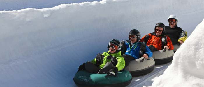 family on toboggan run in Villars ski resort